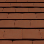 Sandtoft 20/20 tile and half right hand clay plain roof tiles arranged in rows